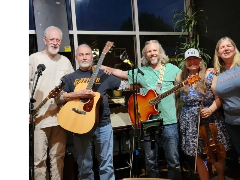 Band group photo with five musicians